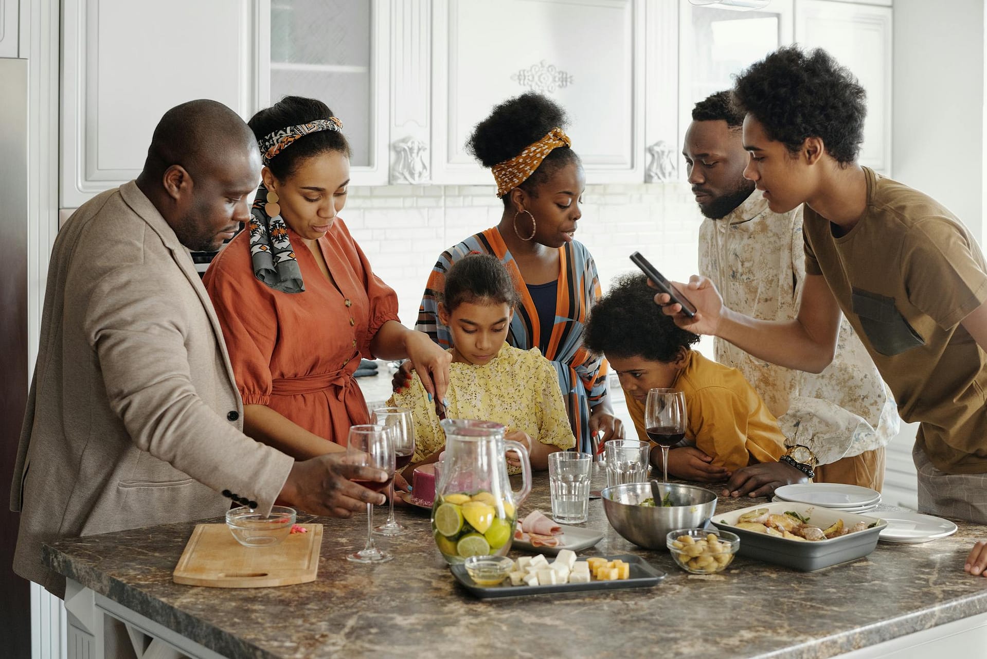 About A Joyful Family Gathering In The Kitchen Enjoying Food And Drinks Together. 4262411 2048x1367